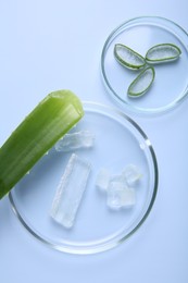 Photo of Flat lay composition with cut aloe vera on light blue background
