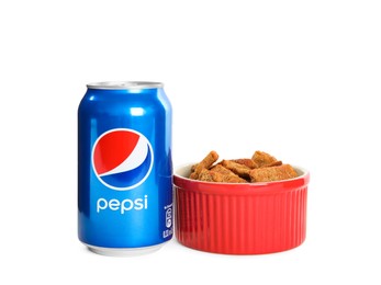 Photo of MYKOLAIV, UKRAINE - FEBRUARY 15, 2021: Can of Pepsi and snack on white background