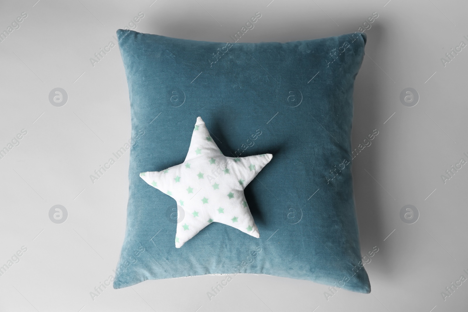 Photo of Soft decorative pillows on light background