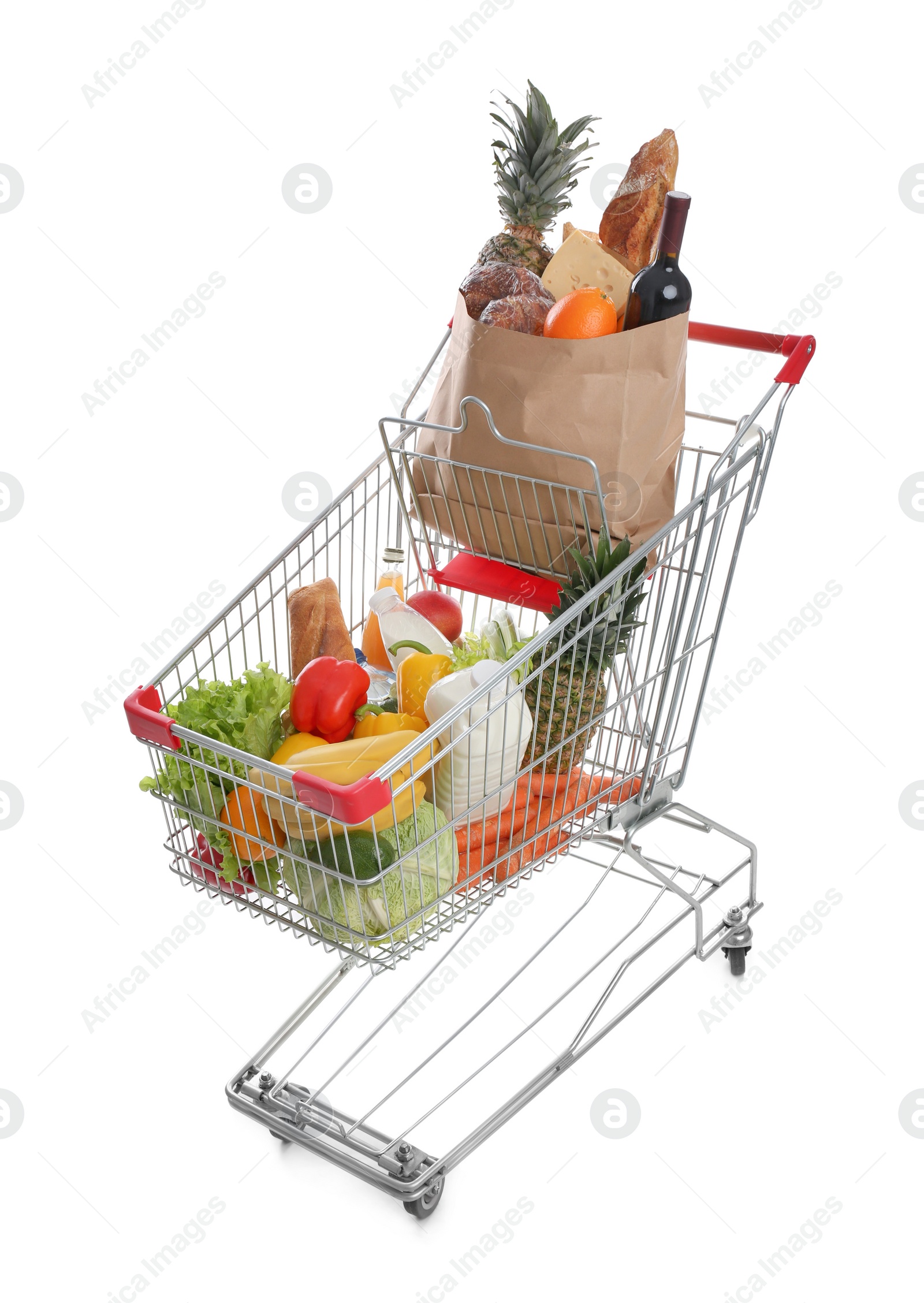 Photo of Shopping cart with groceries on white background