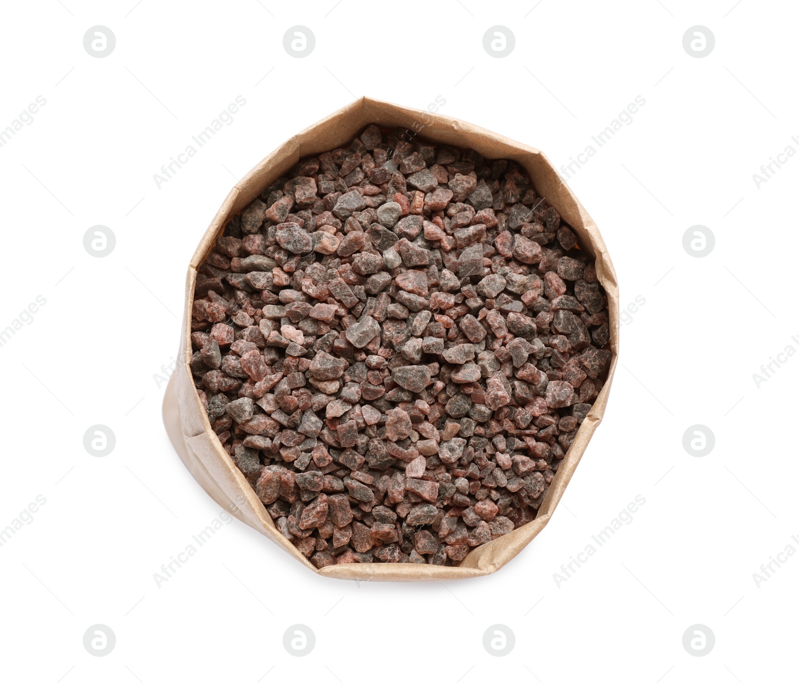 Photo of Black salt in paper bag isolated on white, top view