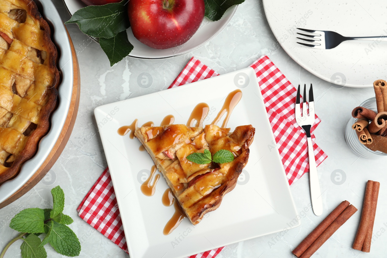 Photo of Slice of traditional apple pie served on table, flat lay