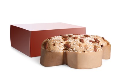 Photo of Cardboard box and delicious Italian Easter dove cake (Colomba di Pasqua) on white background