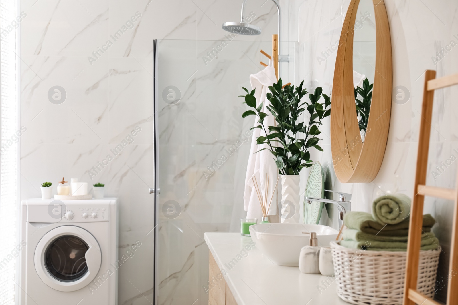 Photo of Modern bathroom interior with stylish mirror and vessel sink