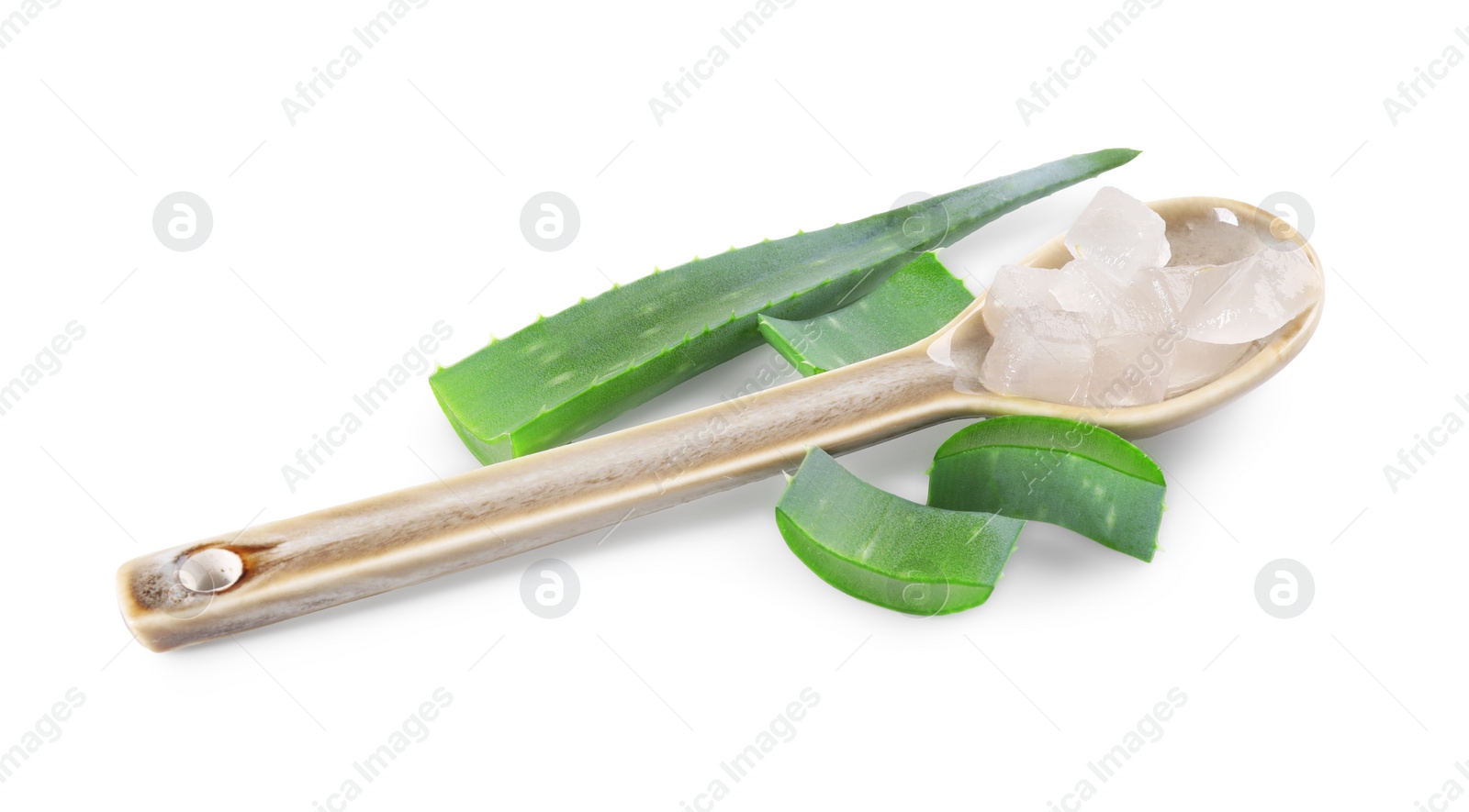 Photo of Spoon with peeled aloe vera and pieces of plant isolated on white