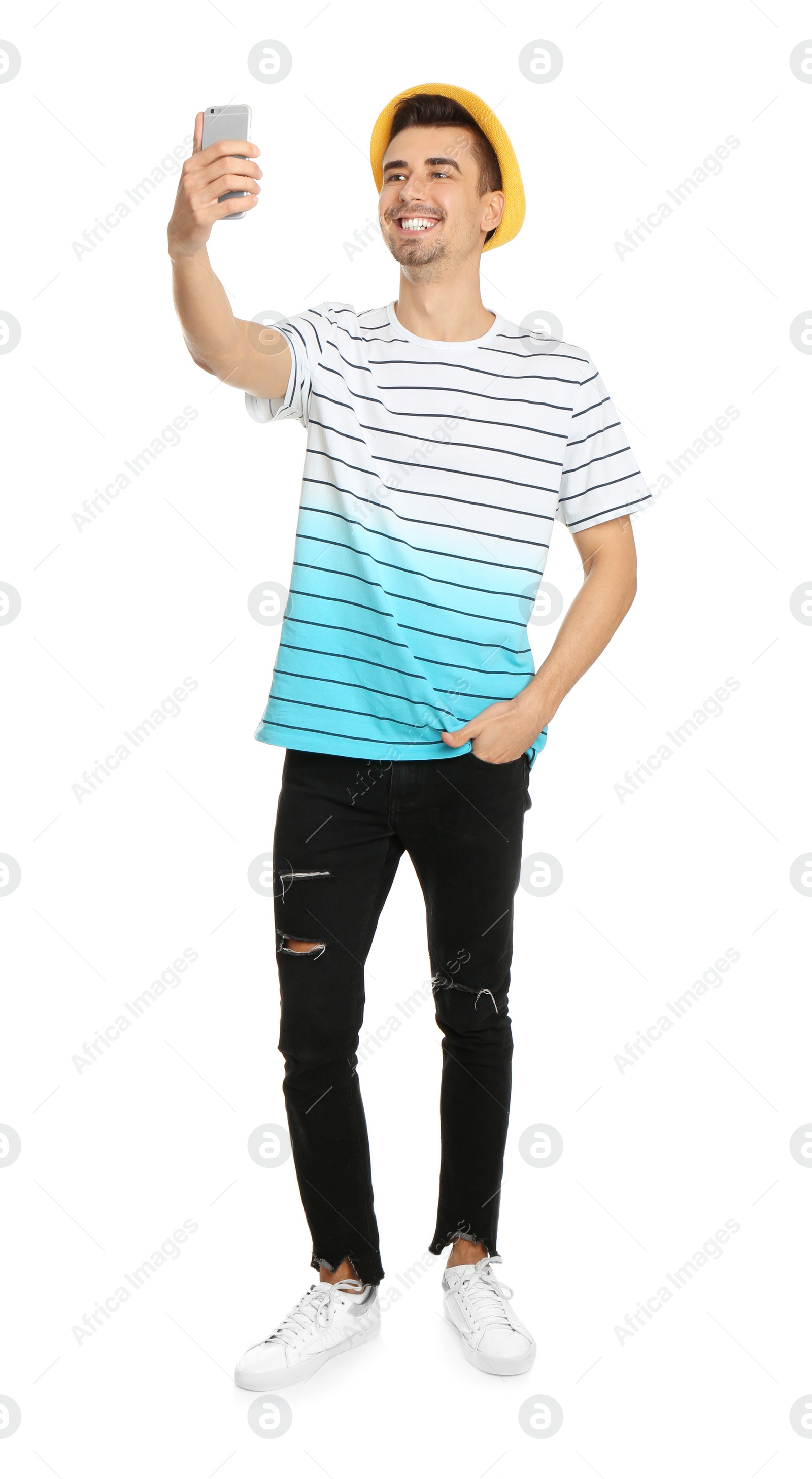 Photo of Young handsome man taking selfie against white background