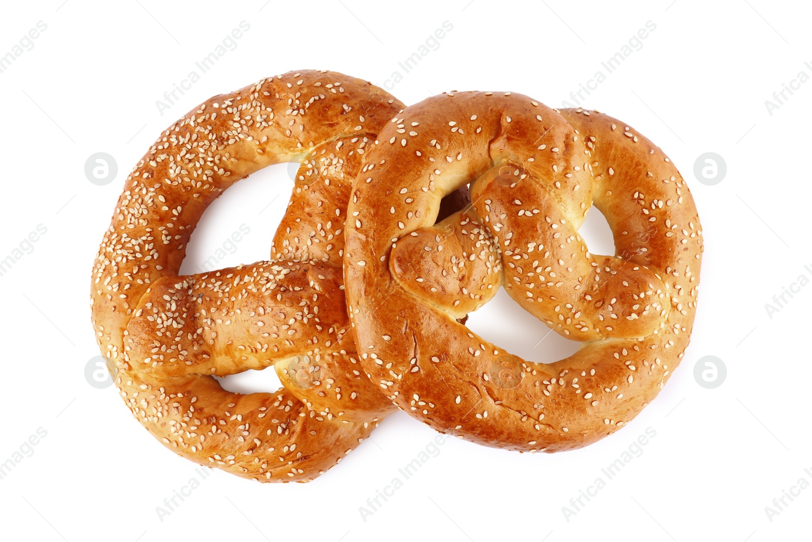 Photo of Tasty freshly baked pretzels on white background, top view
