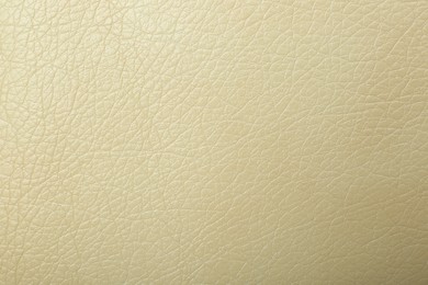 Texture of beige leather as background, closeup