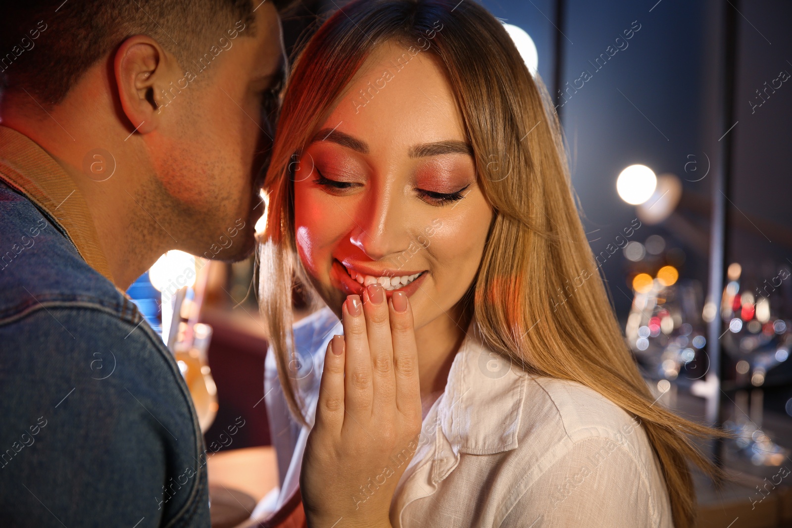 Photo of Man and woman flirting with each other in bar