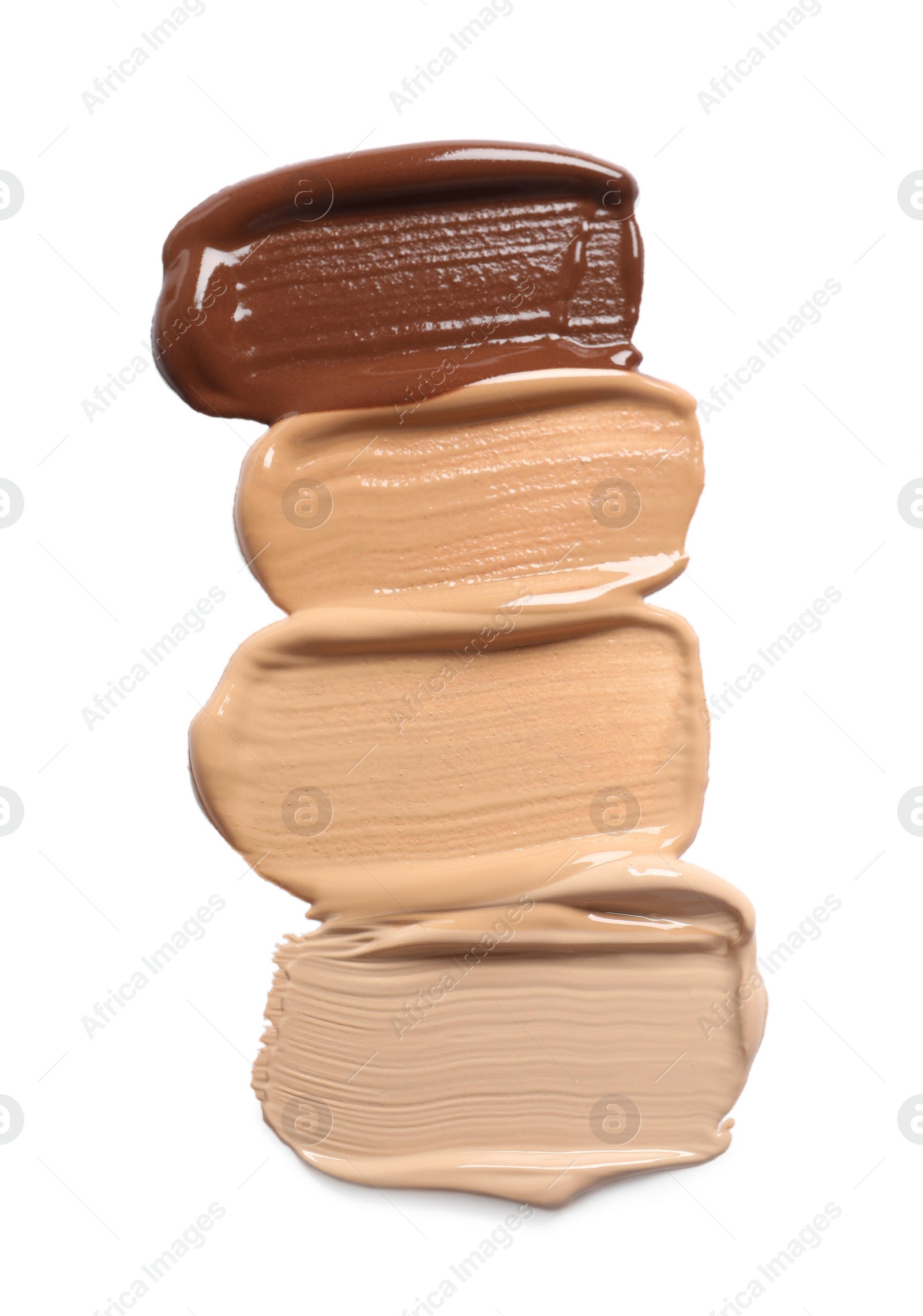 Photo of Samples of skin foundation on white background, top view