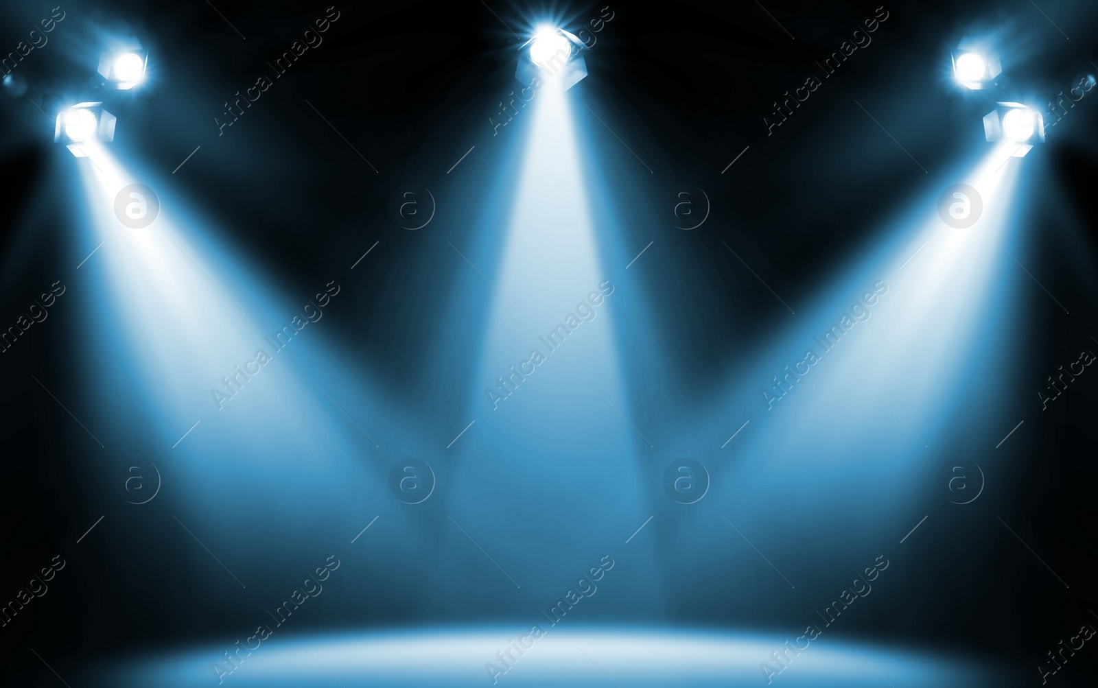 Image of Bright spotlights in darkness. Professional stage equipment