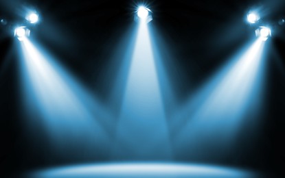 Image of Bright spotlights in darkness. Professional stage equipment