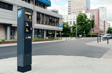 Photo of Modern parking meter on city street, space for text