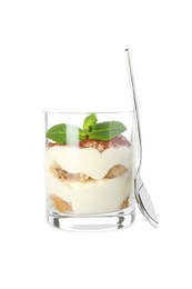 Photo of Delicious tiramisu in glass, mint leaves and spoon isolated on white