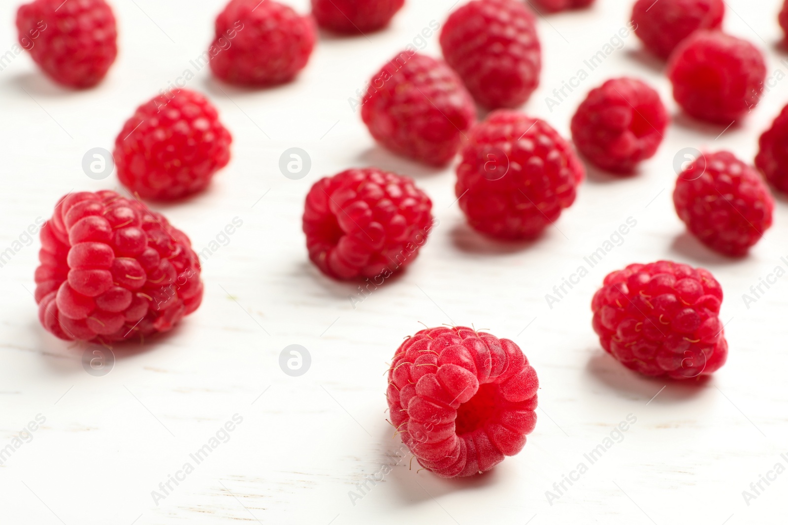 Photo of Ripe aromatic raspberries on table, closeup