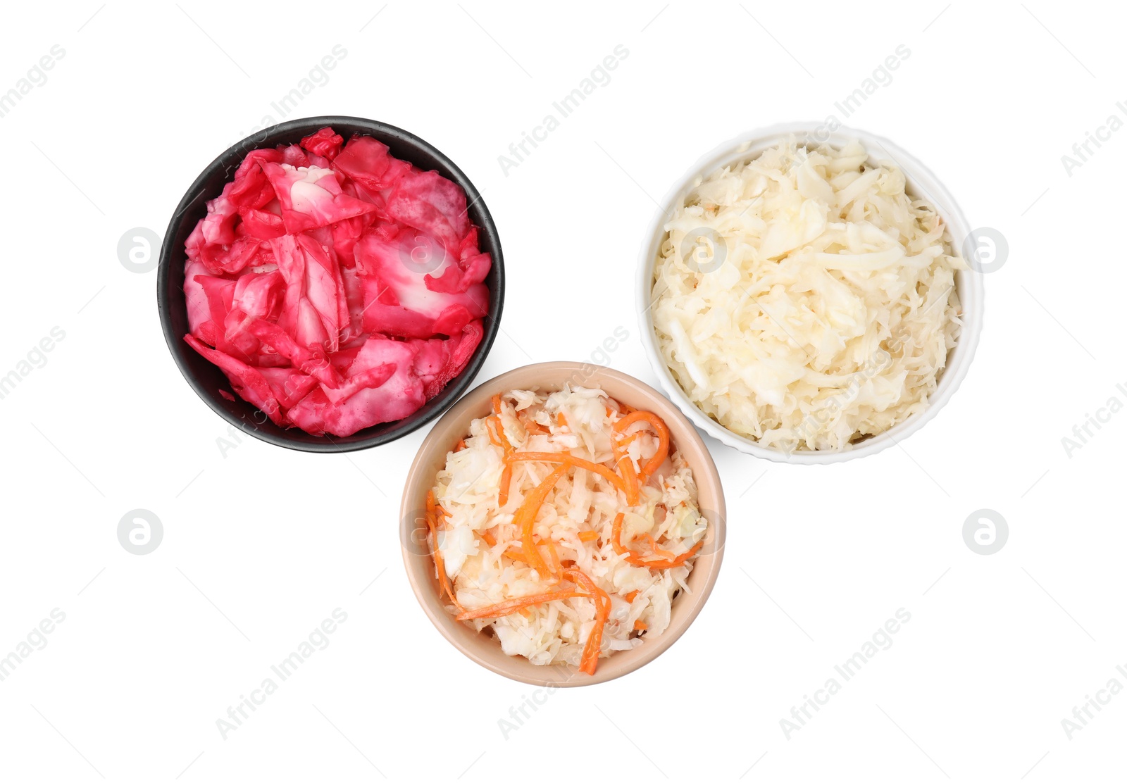 Photo of Delicious sauerkraut prepared according to different recipes on white background, top view