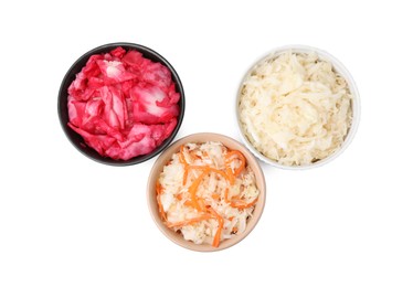 Photo of Delicious sauerkraut prepared according to different recipes on white background, top view