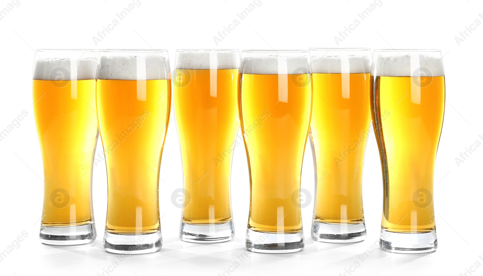 Photo of Glasses of beer on white background