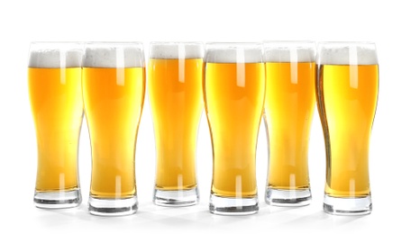 Photo of Glasses of beer on white background