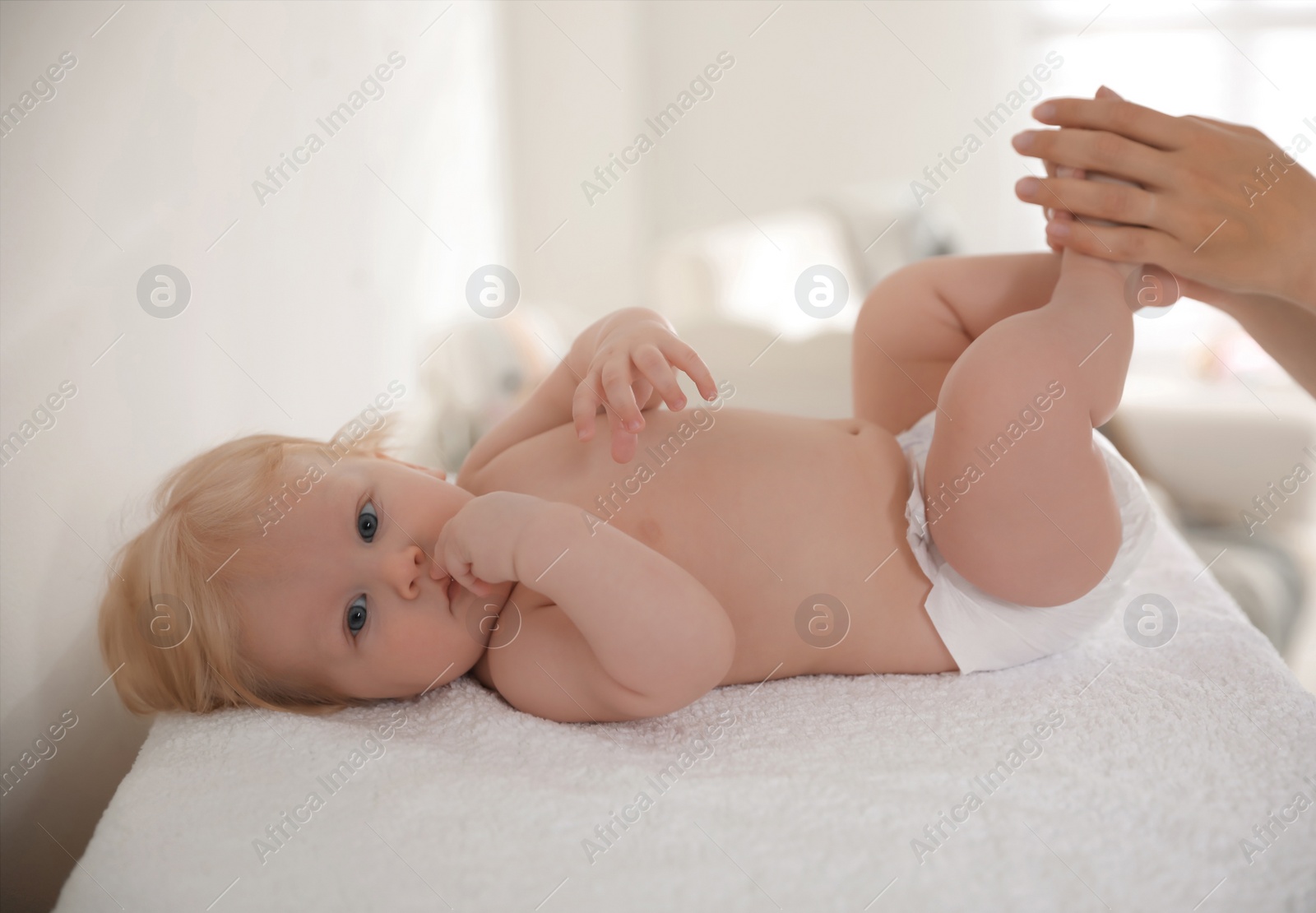 Photo of Mother with her cute little baby indoors