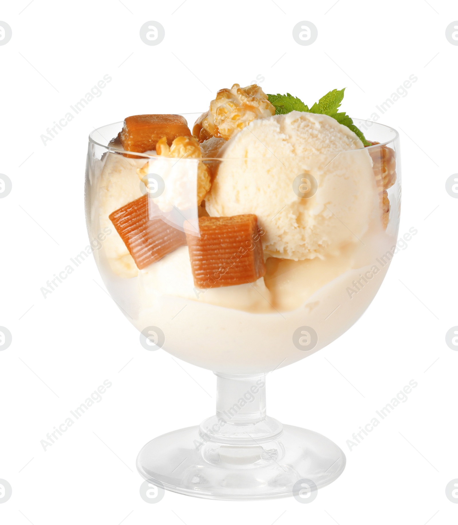 Photo of Delicious ice cream with caramel candies and popcorn in dessert bowl on white background