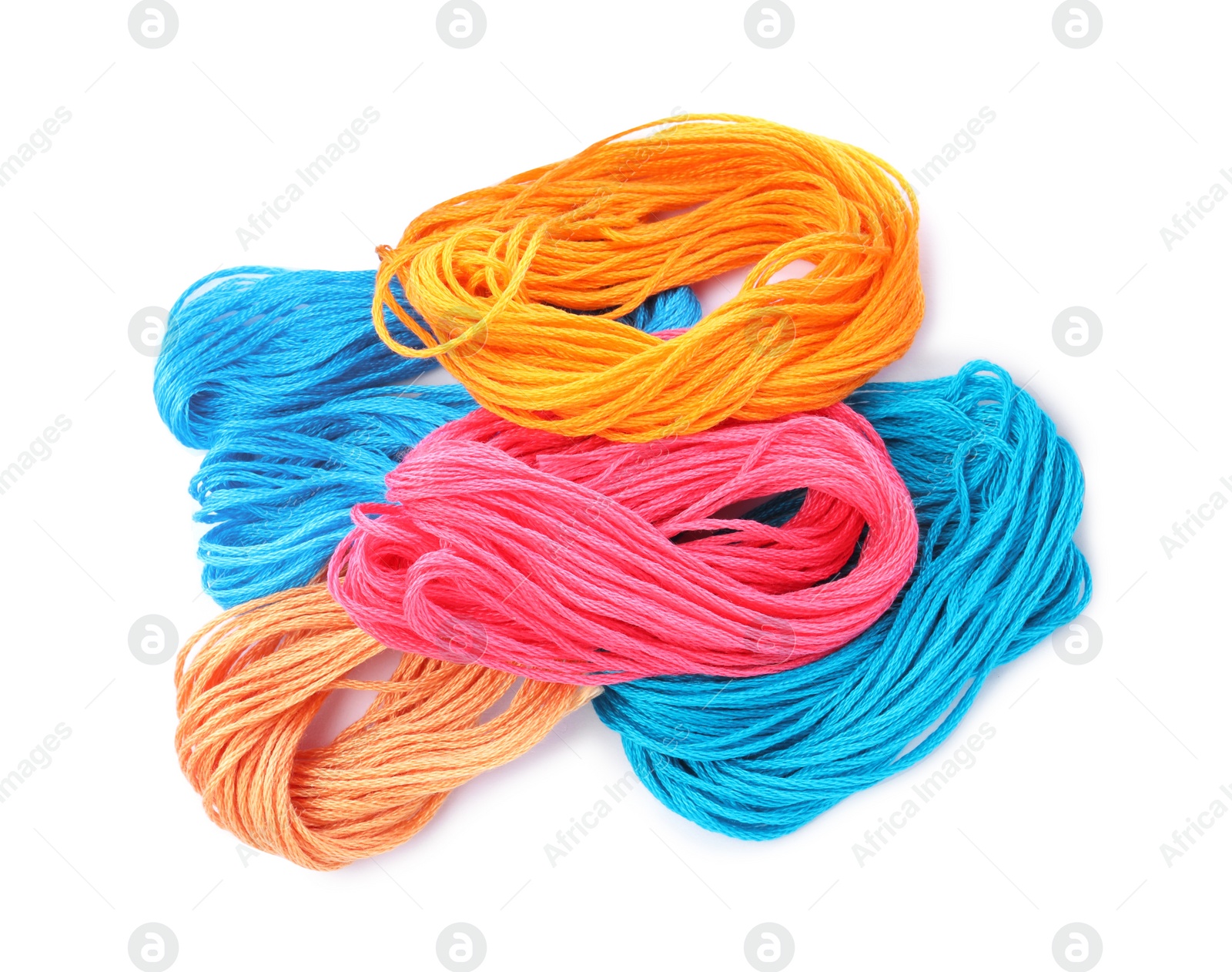 Photo of Different colorful embroidery threads on white background, top view