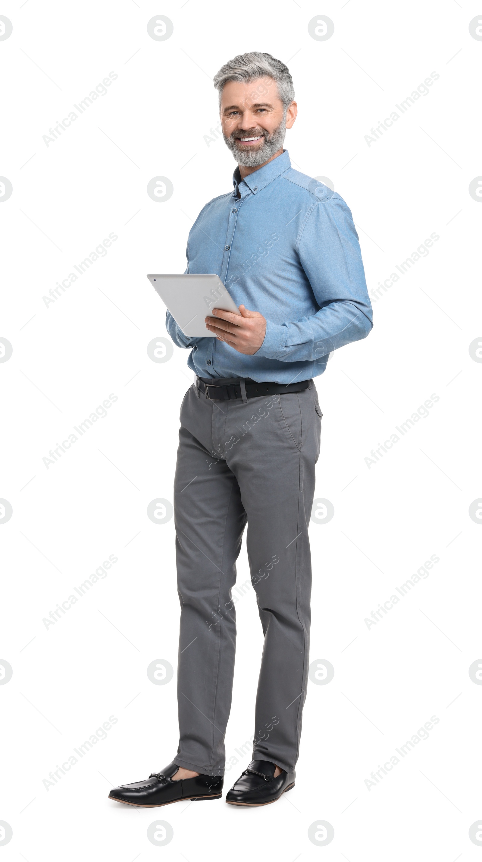 Photo of Mature businessman in stylish clothes with tablet on white background