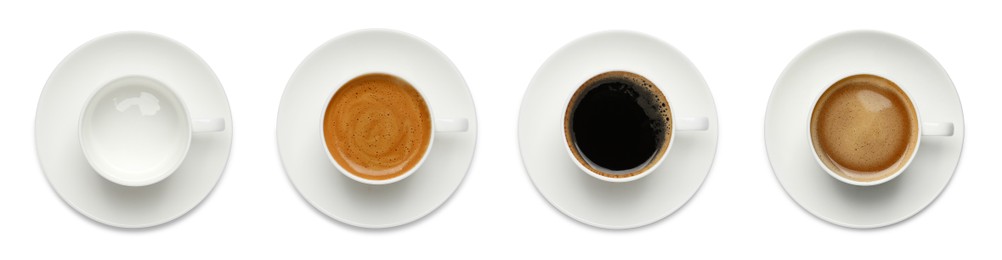 Image of Set with cups of hot aromatic coffee on white background, top view. Banner design
