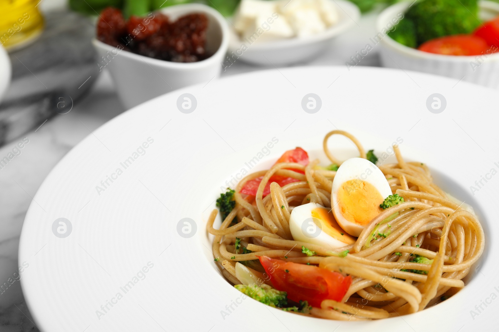 Photo of Tasty buckwheat noodles in plate on table, closeup