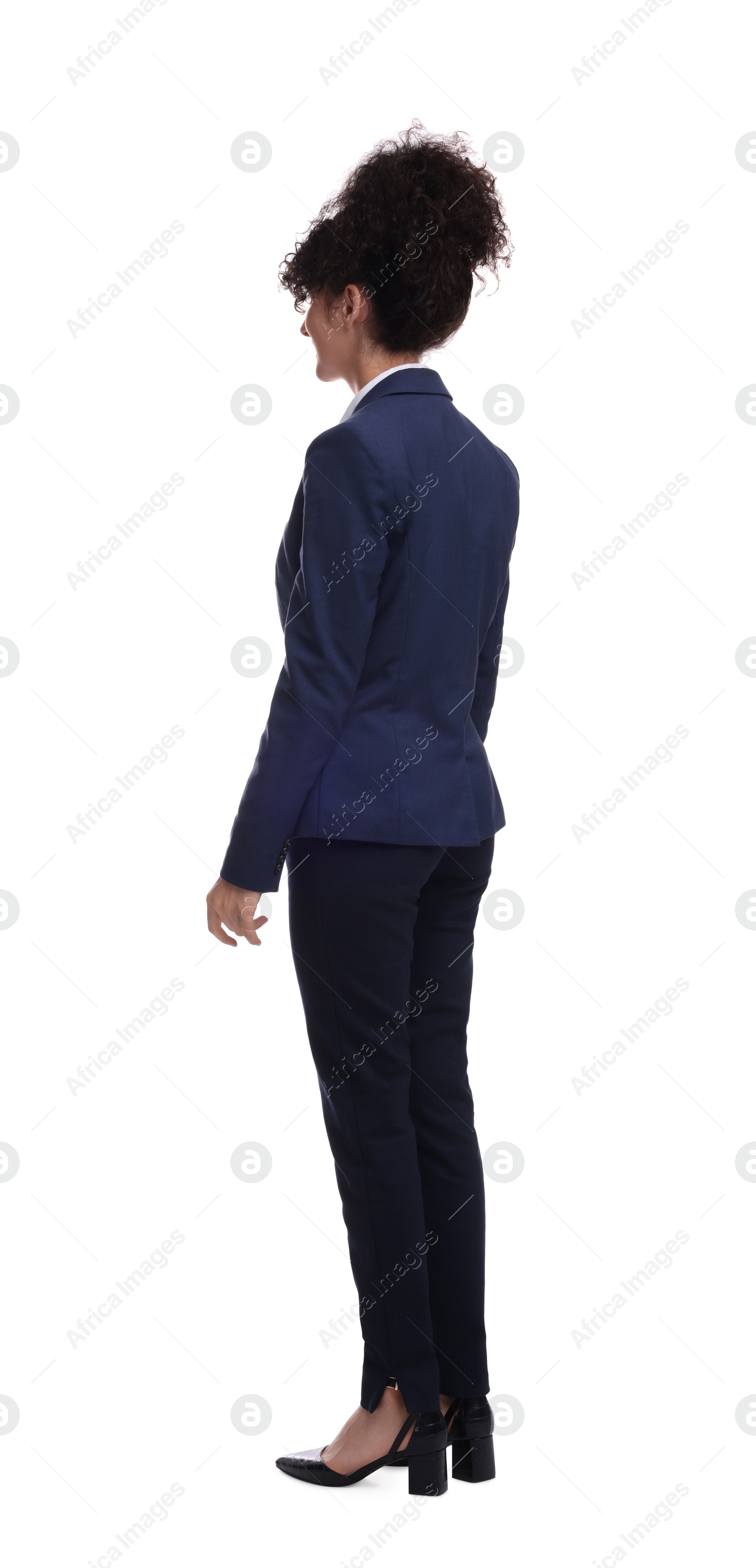 Photo of Young businesswoman in suit standing on white background