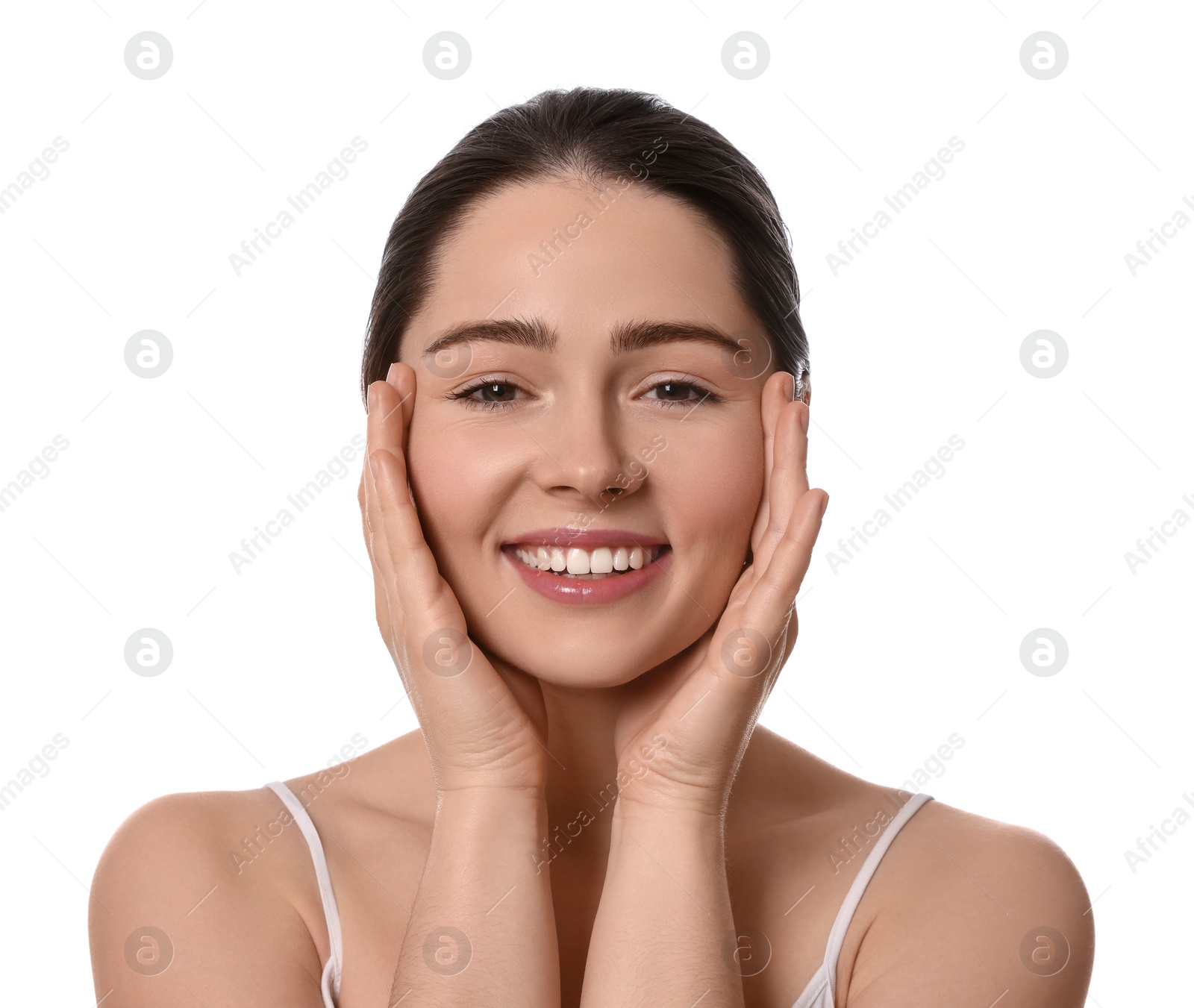 Photo of Young woman massaging her face on white background