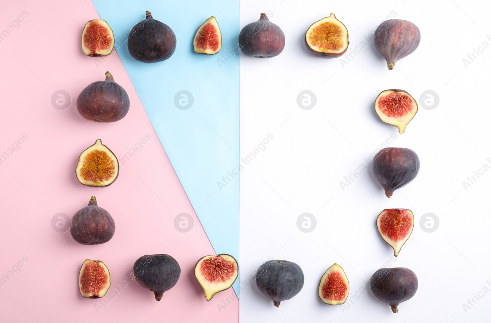 Photo of Delicious ripe figs on color background, flat lay. Space for text