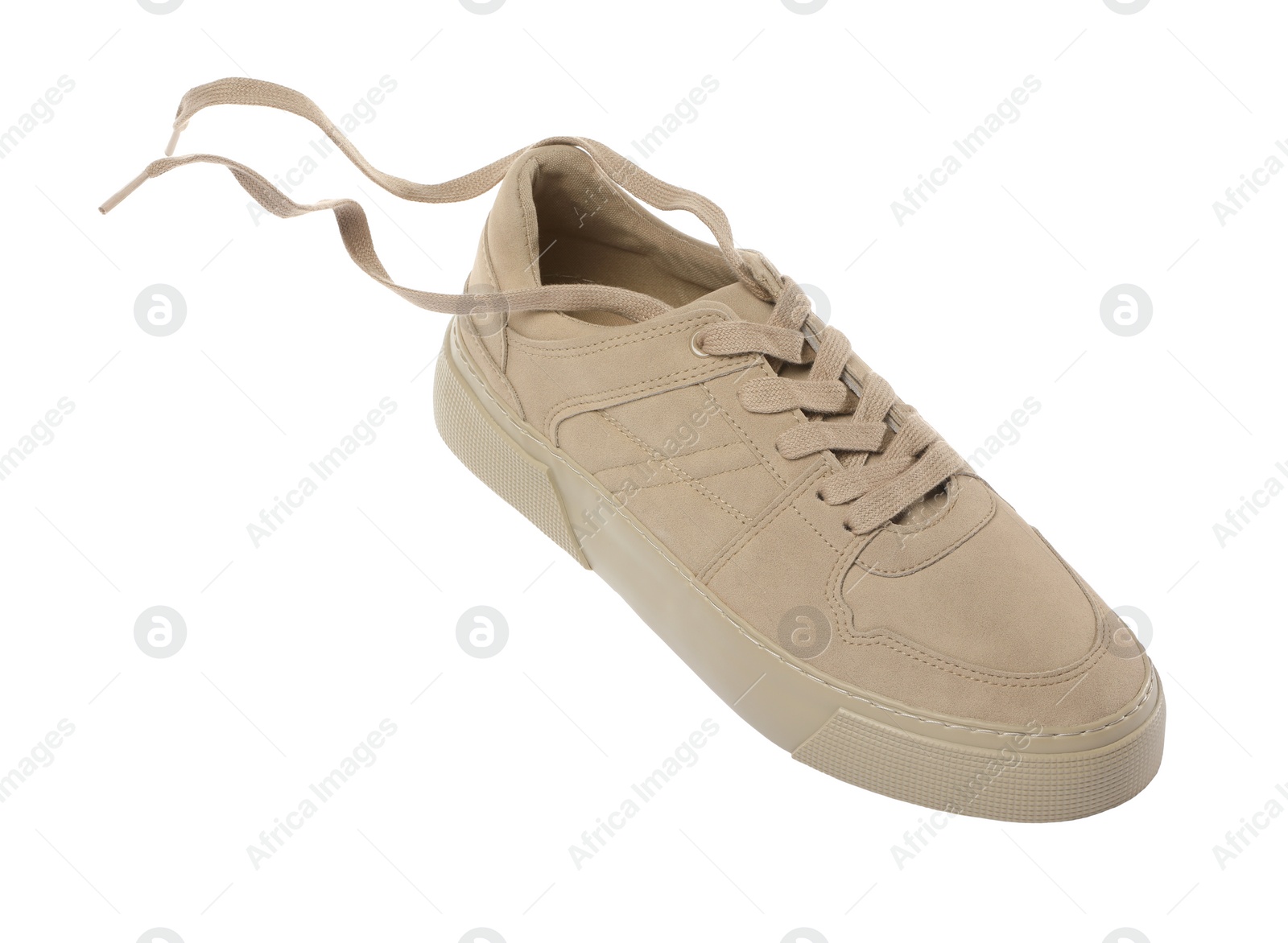 Photo of One stylish beige sneaker isolated on white