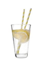 Soda water with lemon slices and straws isolated on white