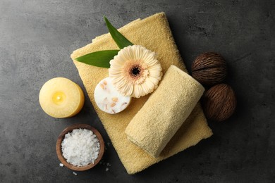 Photo of Flat lay composition with different spa products and walnuts on grey table