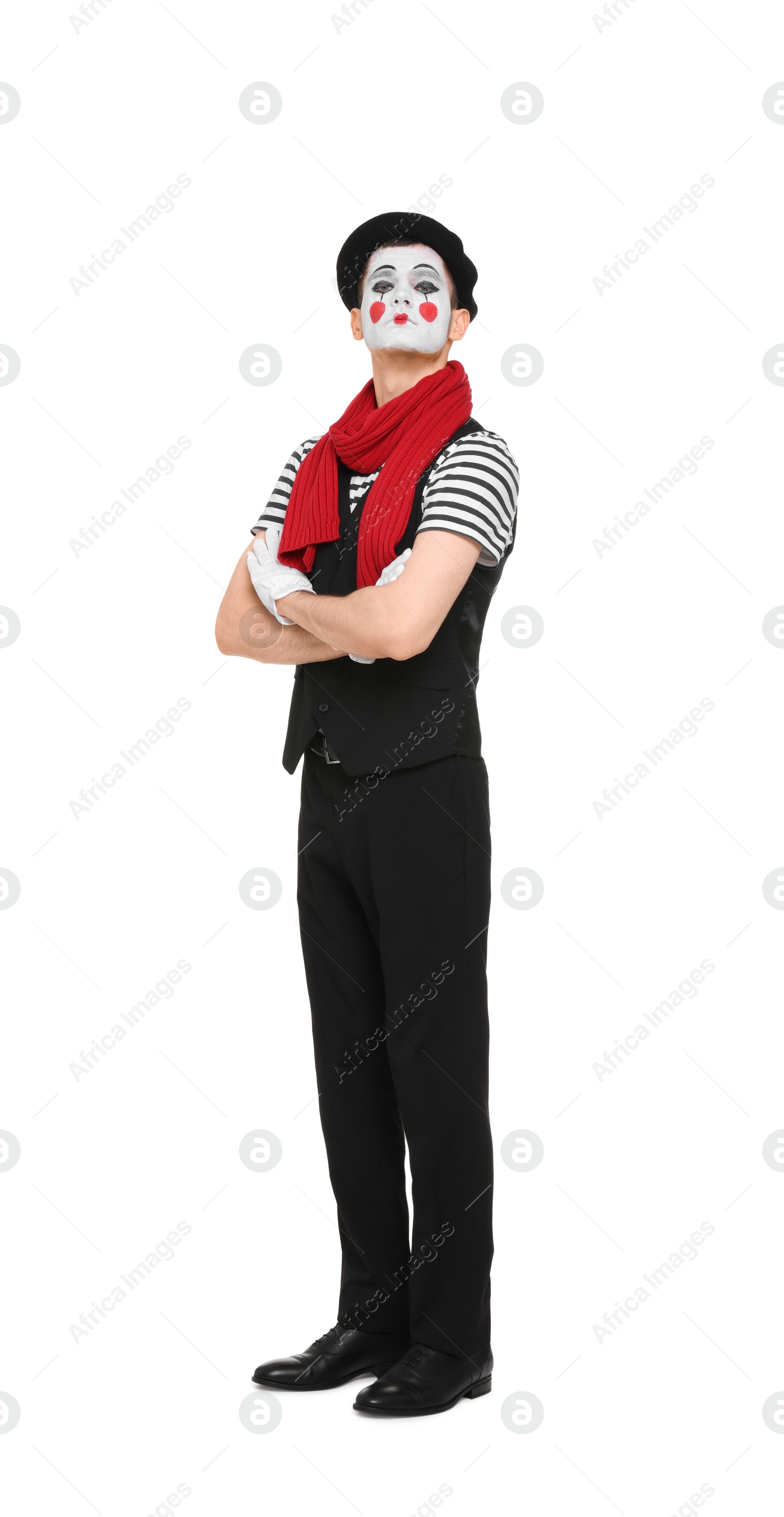 Photo of Funny mime artist in beret posing on white background