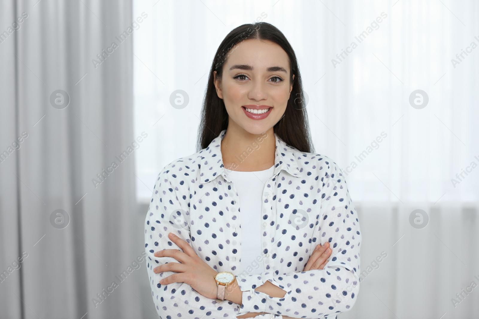 Photo of Portrait of beautiful young woman at home