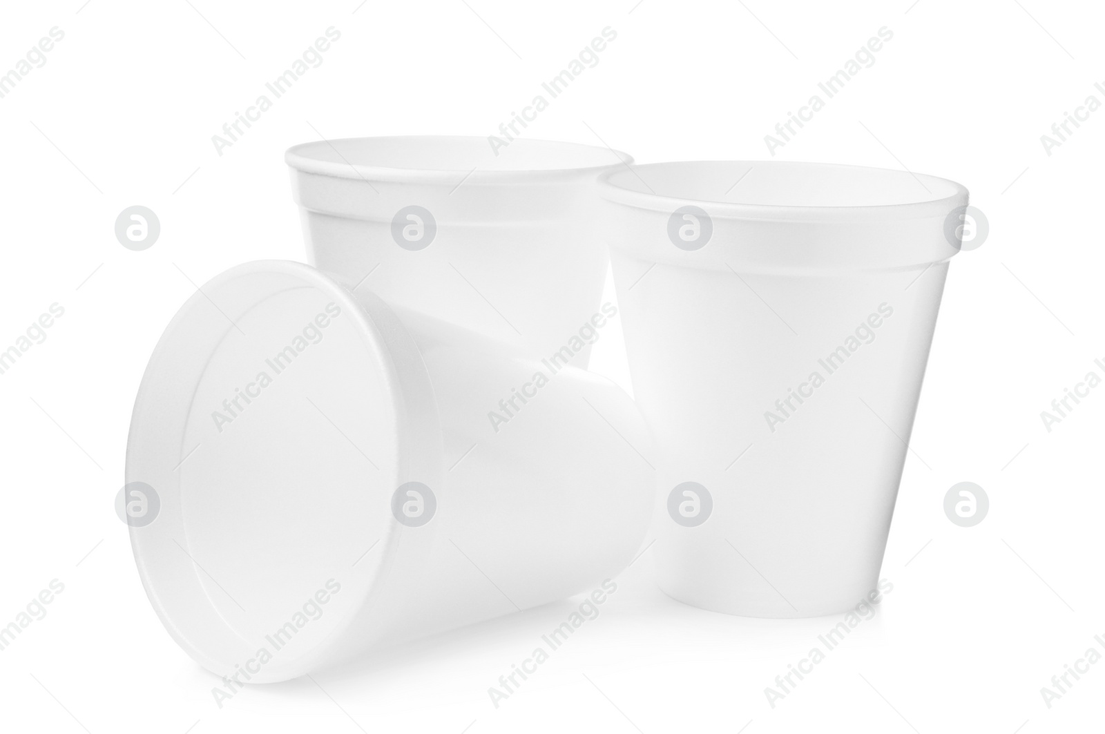 Photo of Three clean styrofoam cups on white background