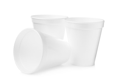 Photo of Three clean styrofoam cups on white background