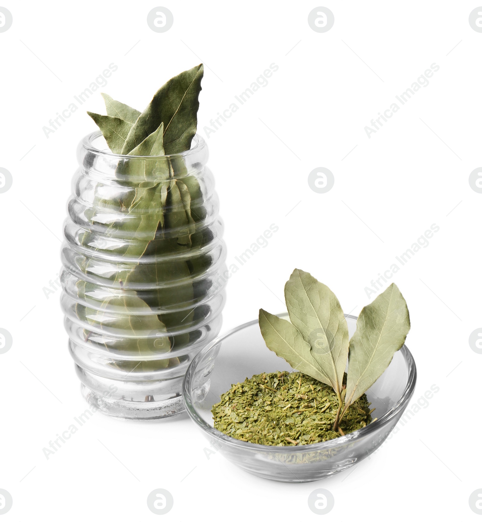 Photo of Ground and whole bay leaves on white background