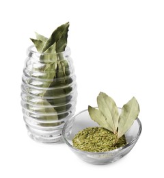 Photo of Ground and whole bay leaves on white background