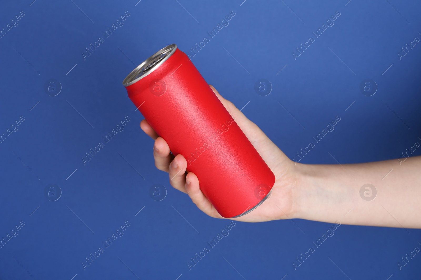 Photo of Woman with energy drink on blue background, closeup