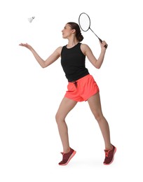 Photo of Young woman playing badminton with racket and shuttlecock on white background