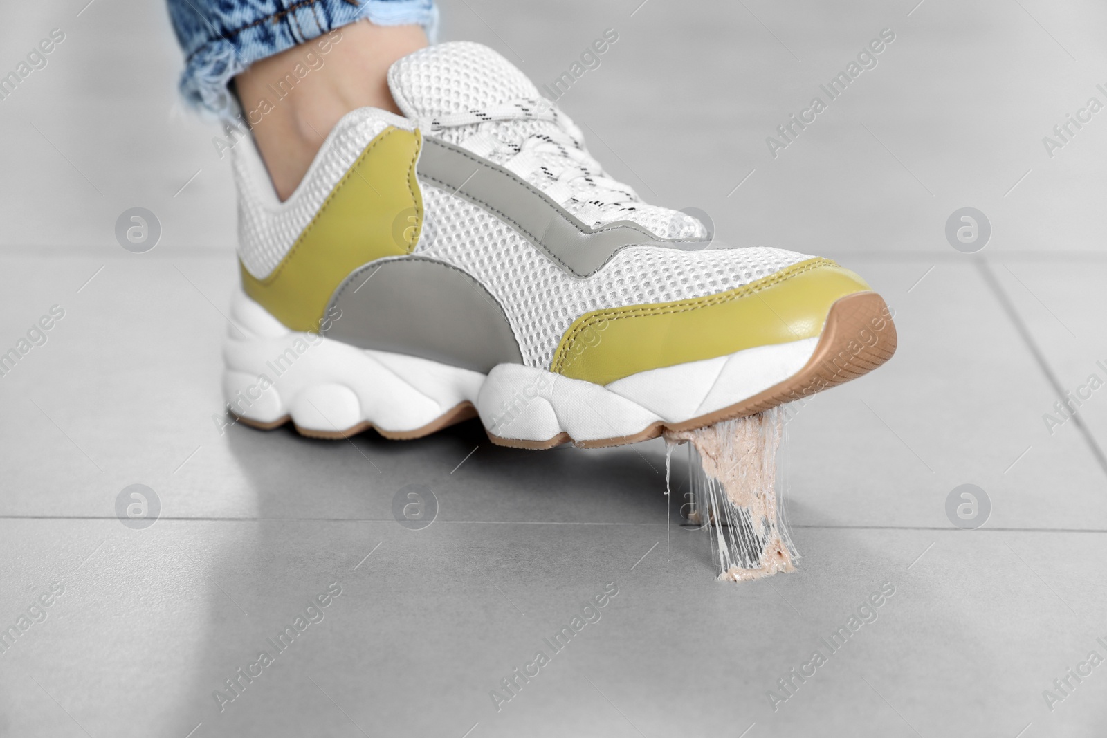 Photo of Person stepping into chewing gum on floor, closeup