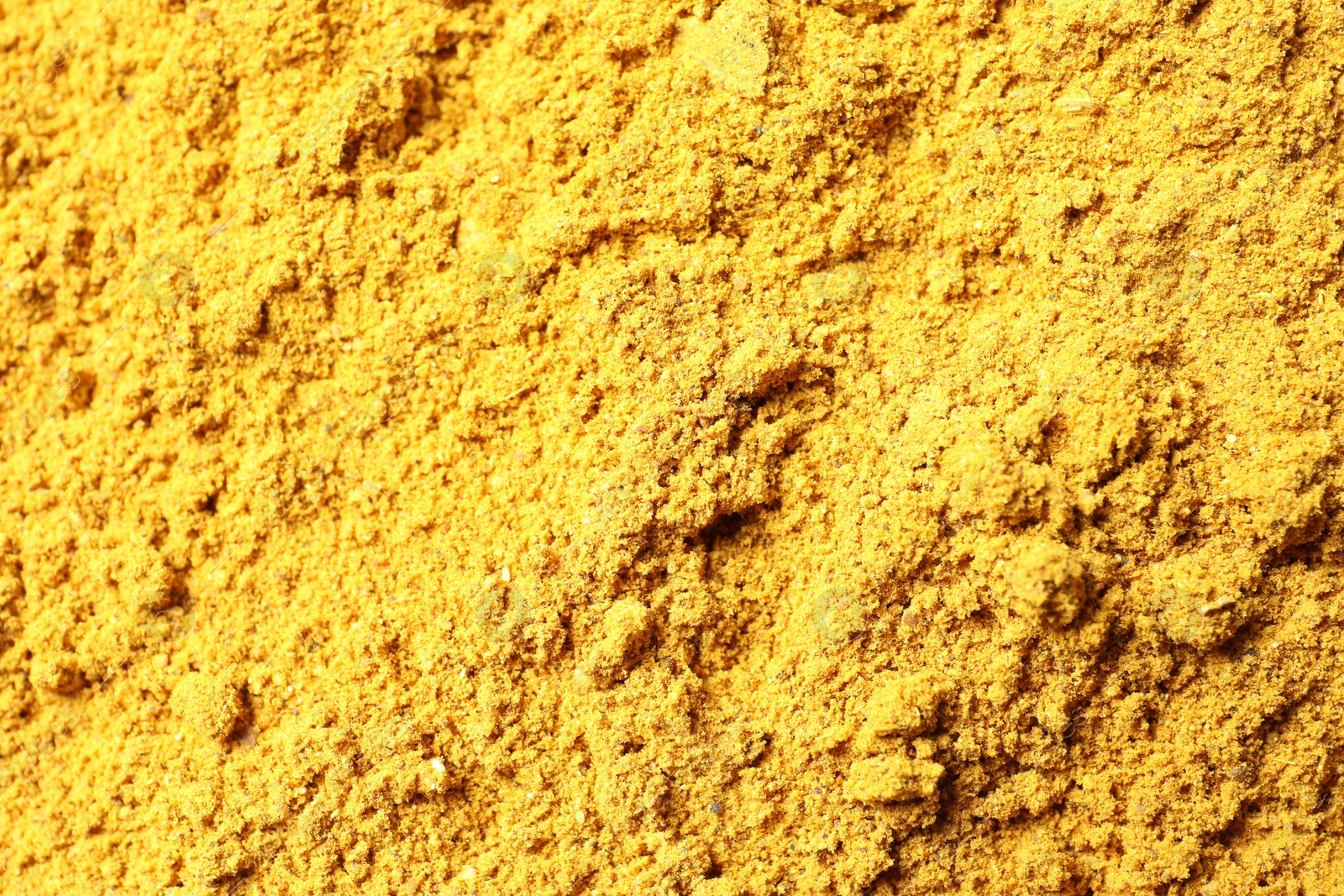 Photo of Dry curry powder as background, top view