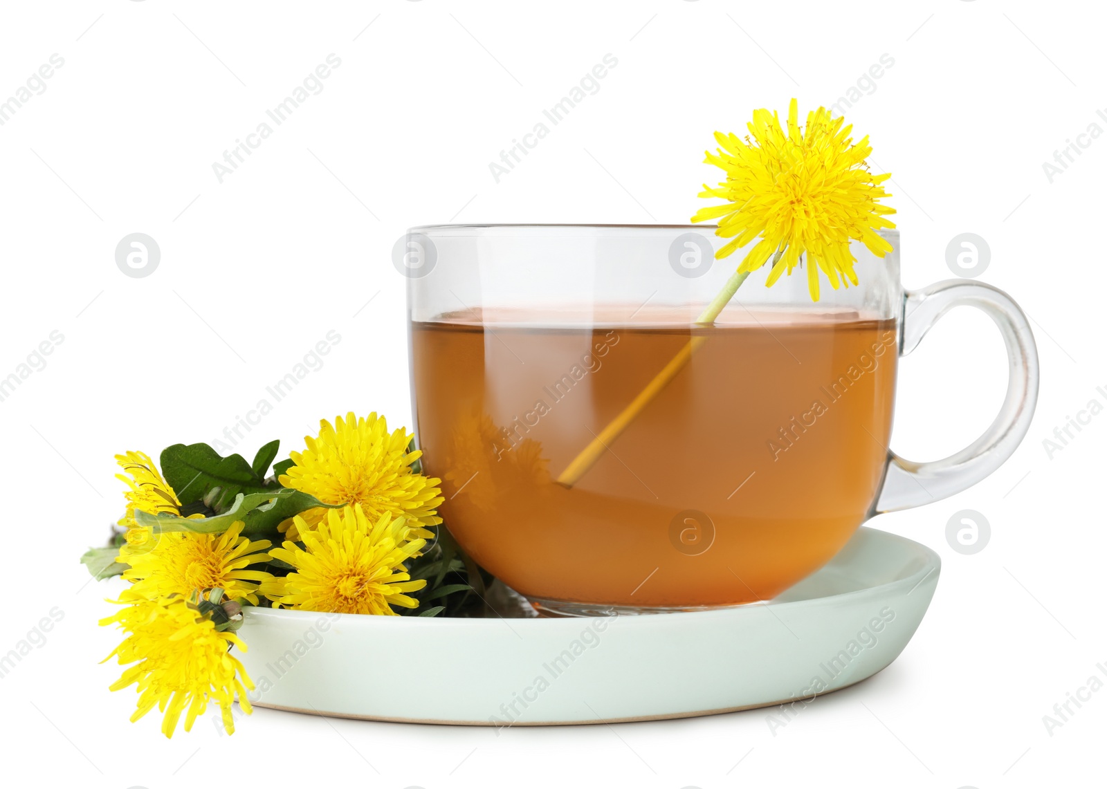 Photo of Delicious fresh tea and beautiful dandelion flowers on white table