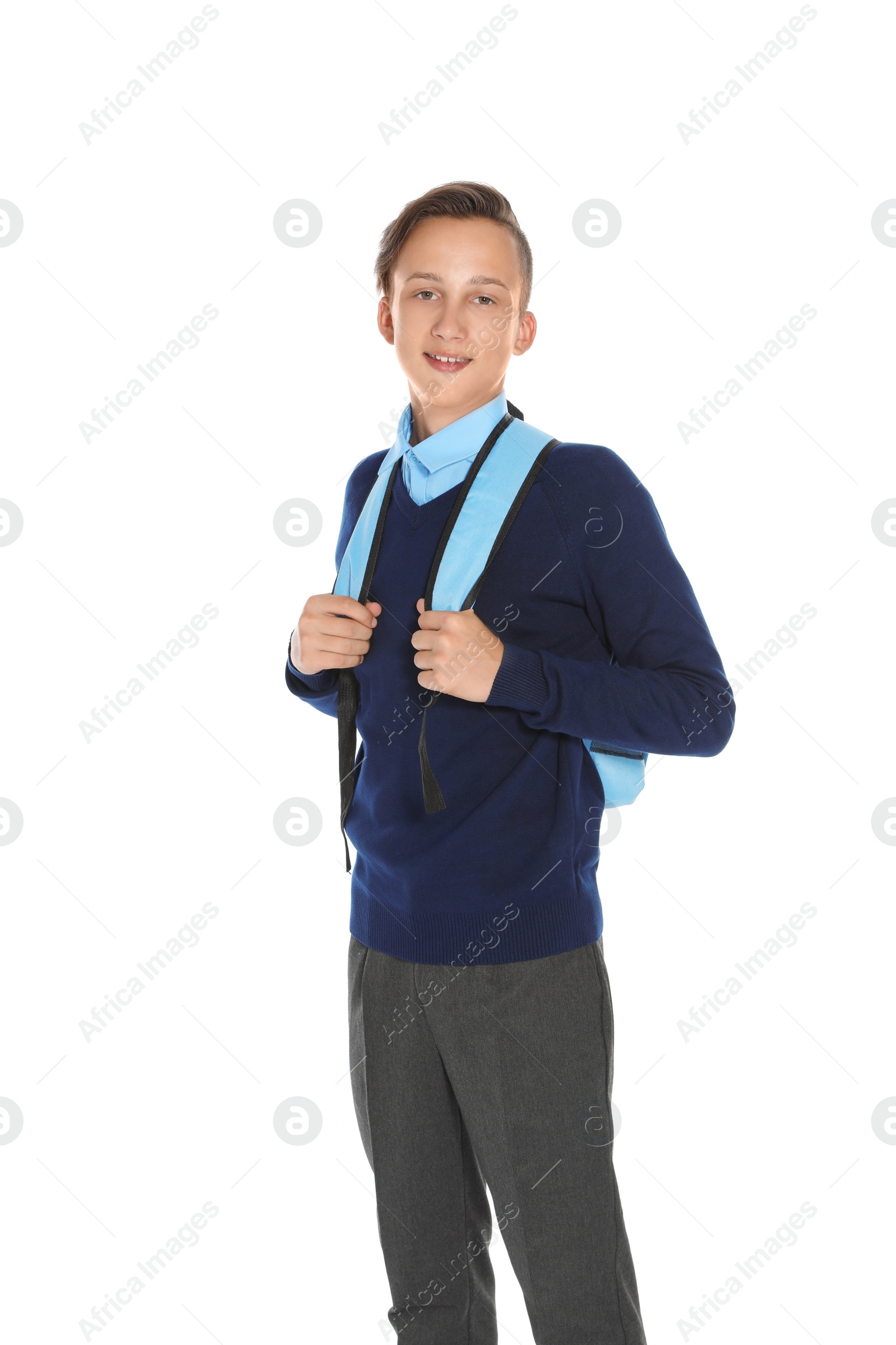 Photo of Teenage boy in stylish school uniform on white background