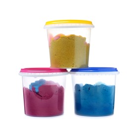 Photo of Kinetic sand and toys in buckets on white background