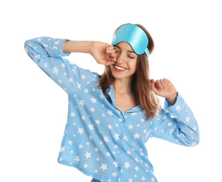 Photo of Beautiful woman wearing pajamas and sleep mask on white background. Bedtime