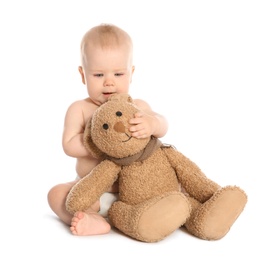 Photo of Cute little baby with toy rabbit on white background